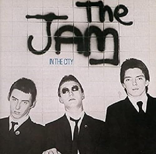 The Jam’s “In The City” album cover featuring three men in suits.