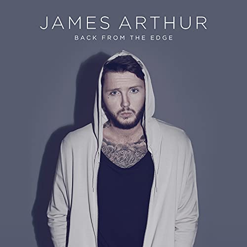 James Arthur album cover: artist in a hoodie, looking at the viewer.