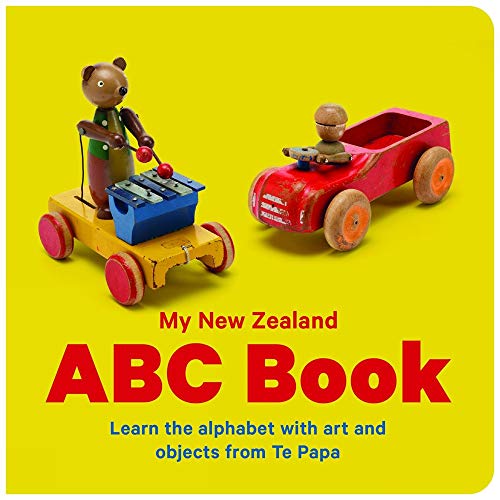 Book cover with vintage wooden toys and large colorful text: "ABC Book".