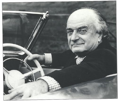 Black and white portrait of an older man in a car.
