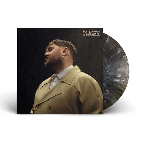 James Vickery in a tan coat with a marbled vinyl record behind the cover.