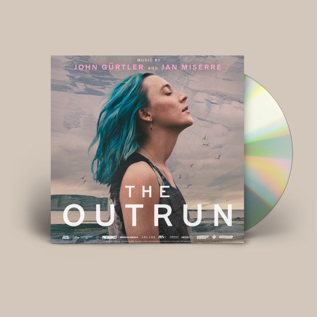 CD cover with a woman with blue hair looking towards the sea.
