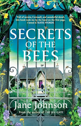 Book cover: thatched cottage behind a gate, bees, and title “Secrets of the Bees”.
