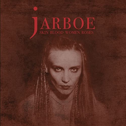 Jarboe album cover featuring a woman with dark braids and intense gaze.
