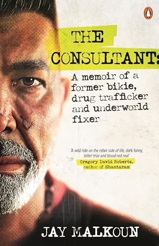 Book cover: close-up portrait of a man with a beard and a scar.