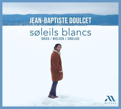 CD cover: Man in brown coat standing in snowy landscape.