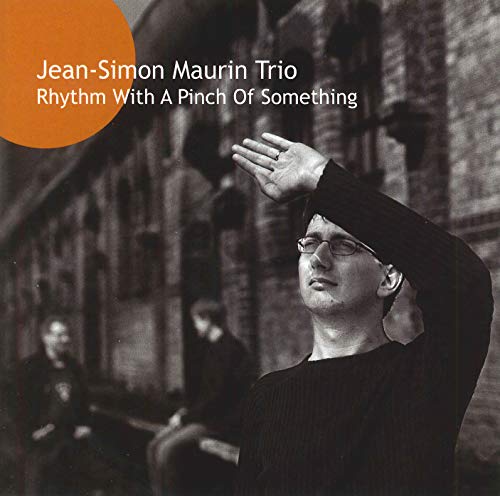 CD cover featuring a jazz trio in front of a stone building.