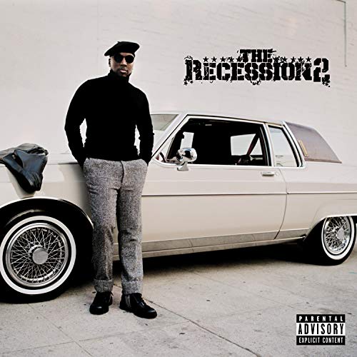 Man in black clothing leaning on a white car with a parental advisory logo.