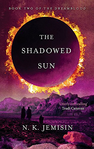 Book cover showing a dark eclipse over a desert landscape with three silhouetted figures.