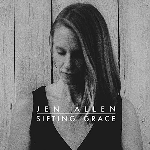 Black and white album cover with a woman in a dark sleeveless top.