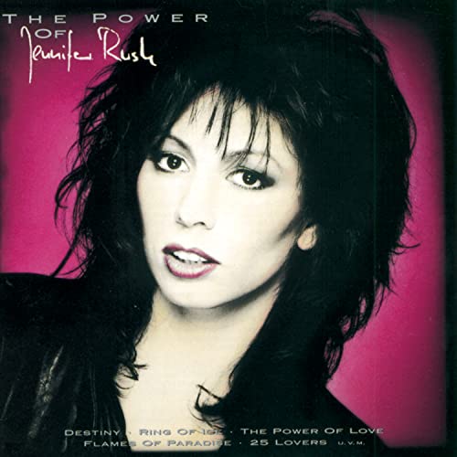 CD cover featuring Jennifer Rush with dark hair and pink background.