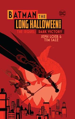 Batman and Robin fly over a city skyline against a large orange pumpkin moon.