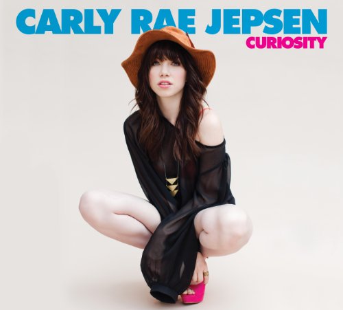 Carly Rae Jepsen album cover, featuring her in a hat and black clothing.