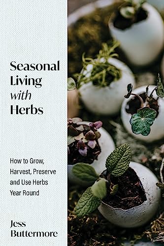 Book cover titled Seasonal Living with Herbs featuring small plants growing in eggshells.