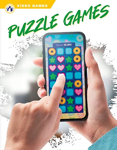 Hand holding a smartphone displaying a colorful match-three puzzle game.
