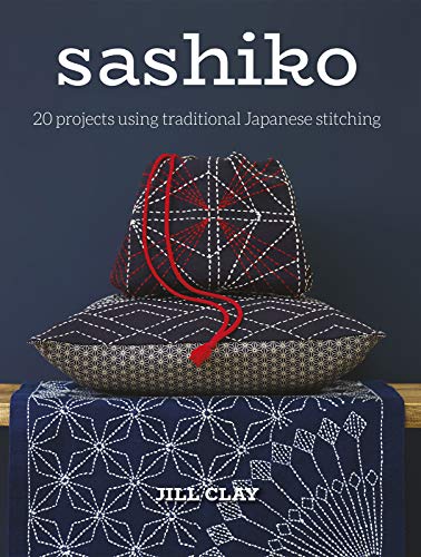 Book cover featuring indigo textiles with white Sashiko stitching details.