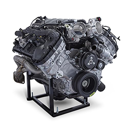 Silver Ford Coyote engine on a black metal stand, detailed view.