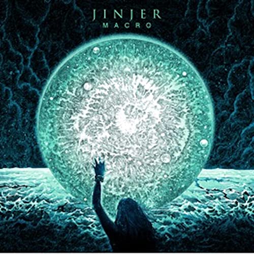 Jinjer’s “Macro” CD cover: a glowing orb with a reaching hand below.