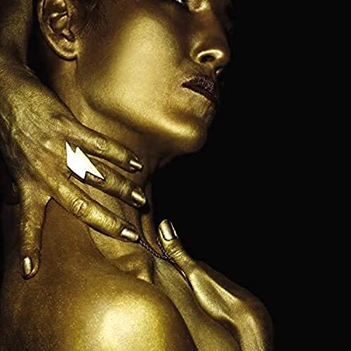 Golden-painted person with a lightning bolt ring, looking upwards.