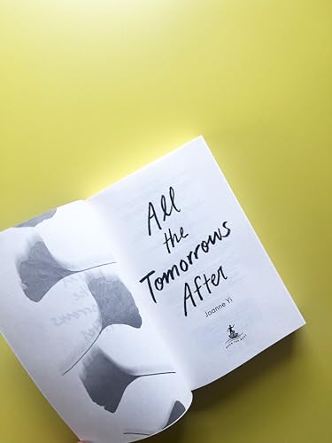 Open book, “All the Tomorrows After” by Joanne Yi, with a grayscale image.