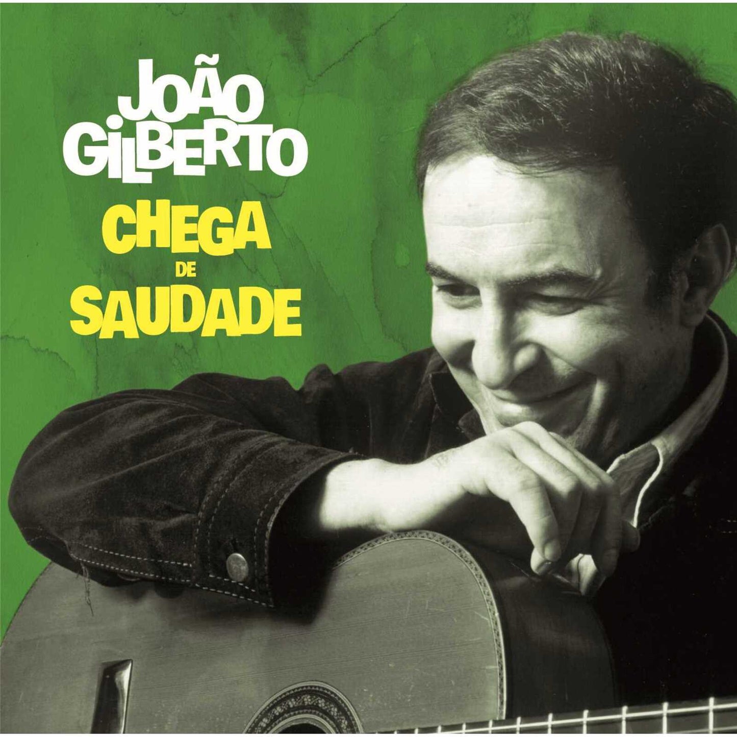 Joao Gilberto smiling while holding a guitar on a green background with album text.