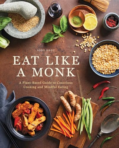 Cookbook cover with plant-based food, title “Eat Like a Monk” visible.