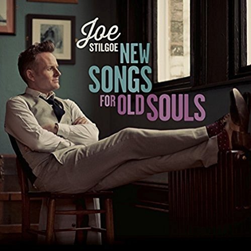 Album cover of Joe Stilgoe reclining in a chair with title text overlayC.