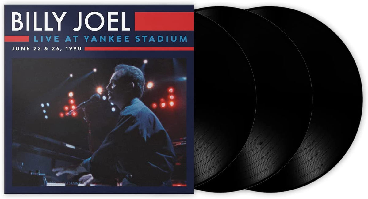 Billy Joel vinyl album cover featuring the artist singing into a microphone on stage.