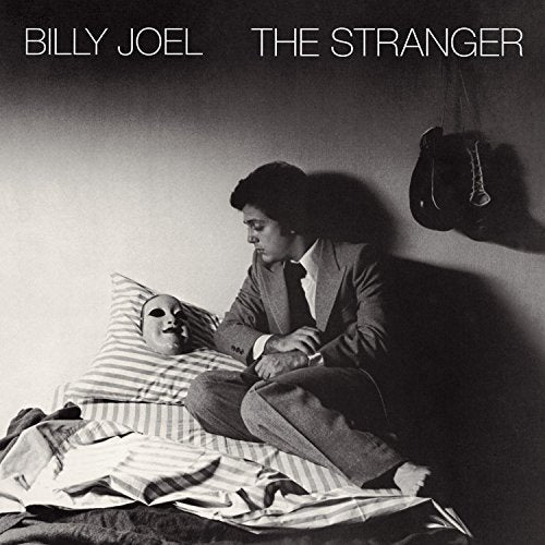 Billy Joel’s “The Stranger” album cover: man, pillow, boxing glove.