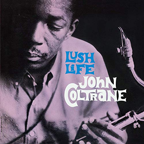 John Coltrane album cover featuring a man playing a saxophone with blue and white text.