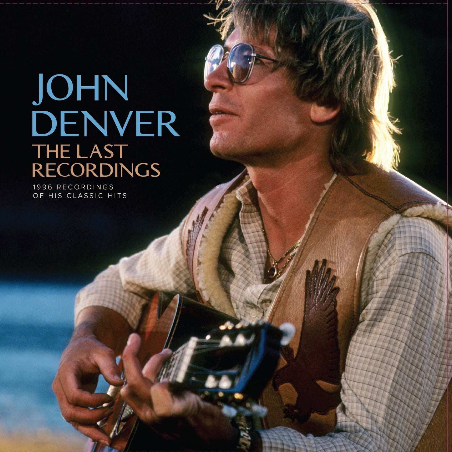 John Denver portrait album cover, “The Last Recordings,” with guitar.