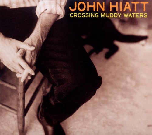 John Hiatt album cover: seated man with a dog, sepia tone.