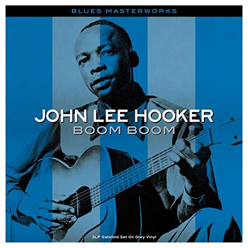 John Lee Hooker album cover, portrait with guitar, blue background.