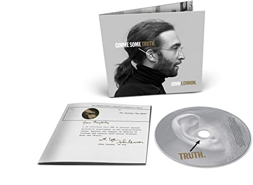 John Lennon CD with booklet and signature on white background.