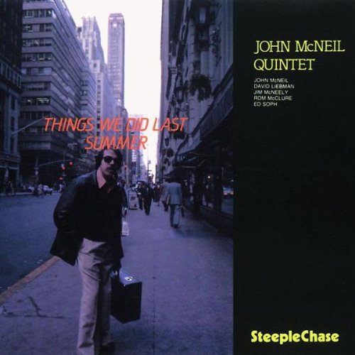 "Album cover with man walking on city sidewalk, title and artist name displayed prominently."