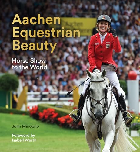 Equestrian rider on a white horse, crowd in the background.