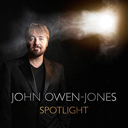 John Owen-Jones portrait with dramatic lighting, album “Spotlight” text.