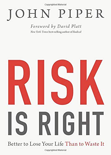 Book cover with large red text "RISK IS RIGHT" and author "John Piper.