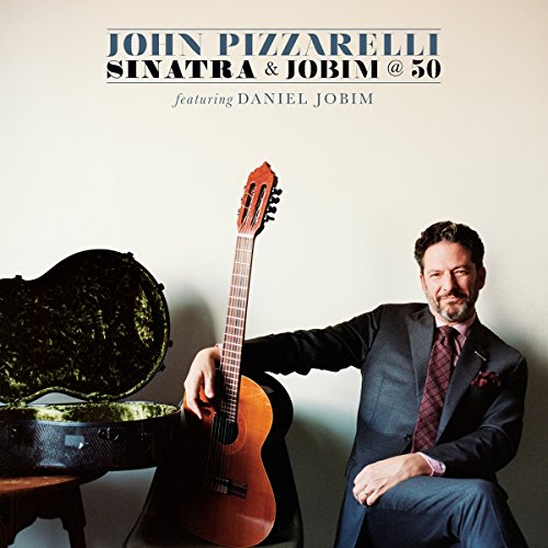 John Pizzarelli album cover featuring a guitarist and open guitar case.