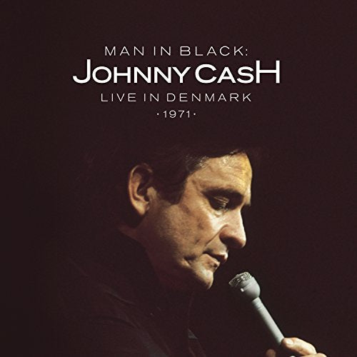 Johnny Cash portrait in black, singing into a microphone on album cover.