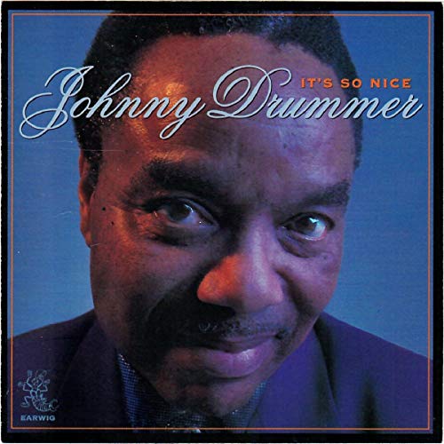 CD cover featuring a close-up portrait of Johnny Drummer with cursive text.