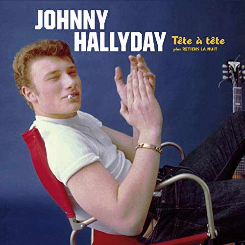 "Johnny Hallyday vinyl album cover featuring a man sitting in a red chair."