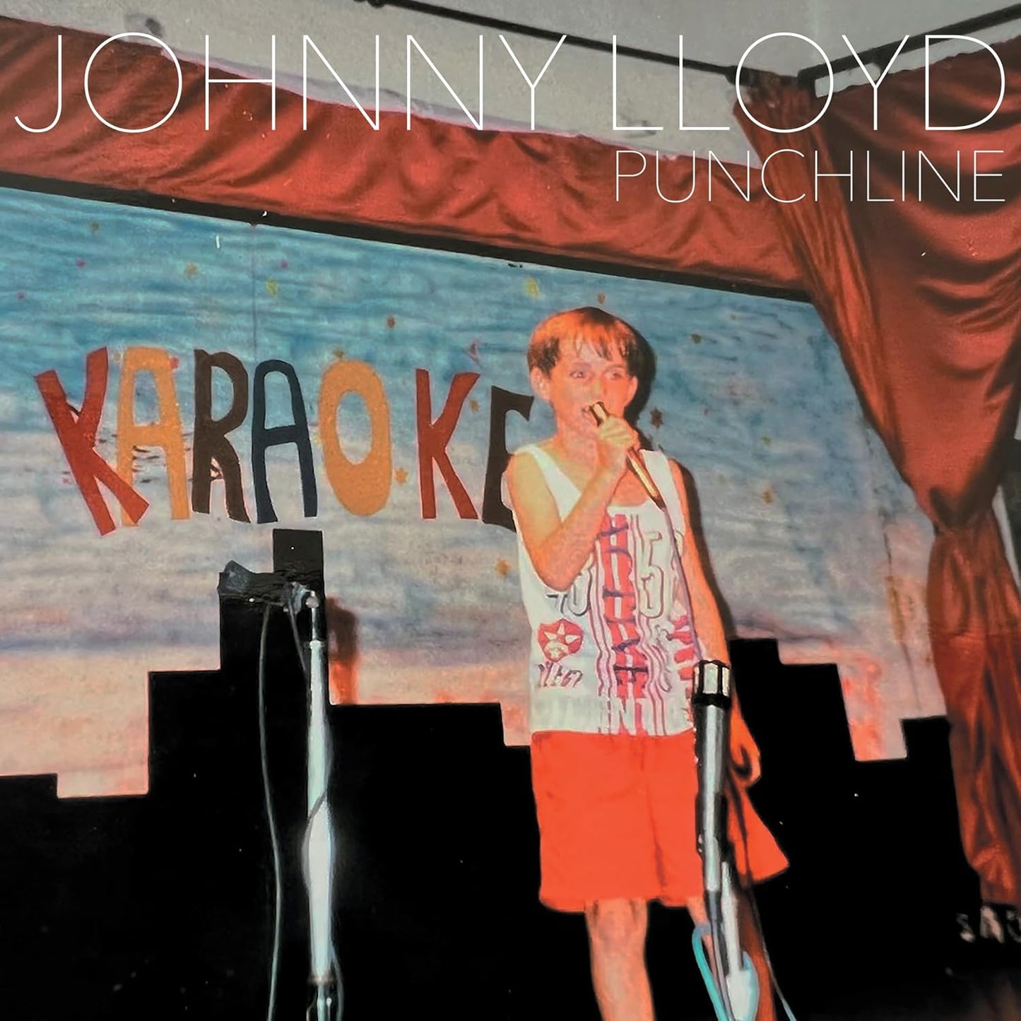 CD cover for Johnny Lloyd’s “Punchline” featuring a man singing karaoke.