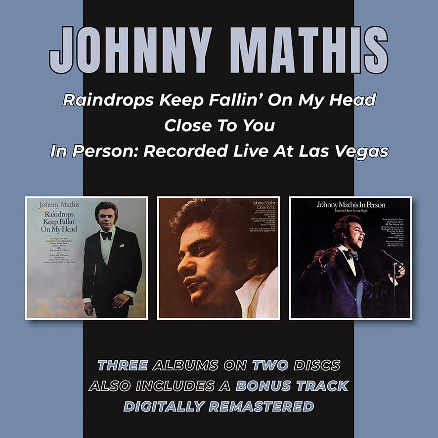 CD cover featuring Johnny Mathis with three album art thumbnails on a blue background.