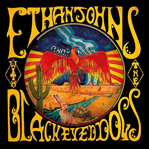 Vinyl album cover with desert scene, red bird, and yellow ornate text on black background.