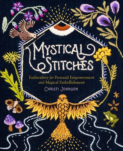 Book cover featuring embroidered designs of a bird, owl, flowers, and mushrooms on fabric.
