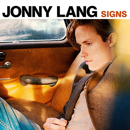 Jonny Lang album cover, "Signs," featuring a young man in a car.
