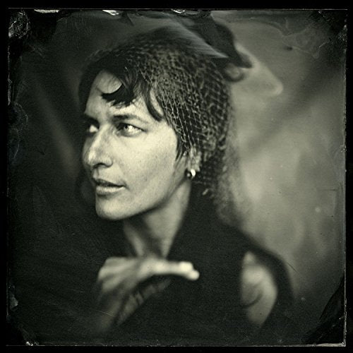 Black and white portrait of Josephine Foster with textured head covering.
