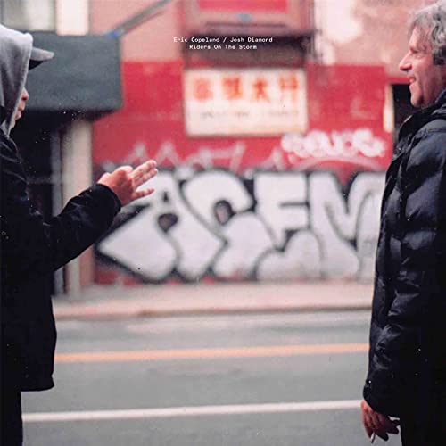 Vinyl album cover: two figures facing each other in front of graffiti.