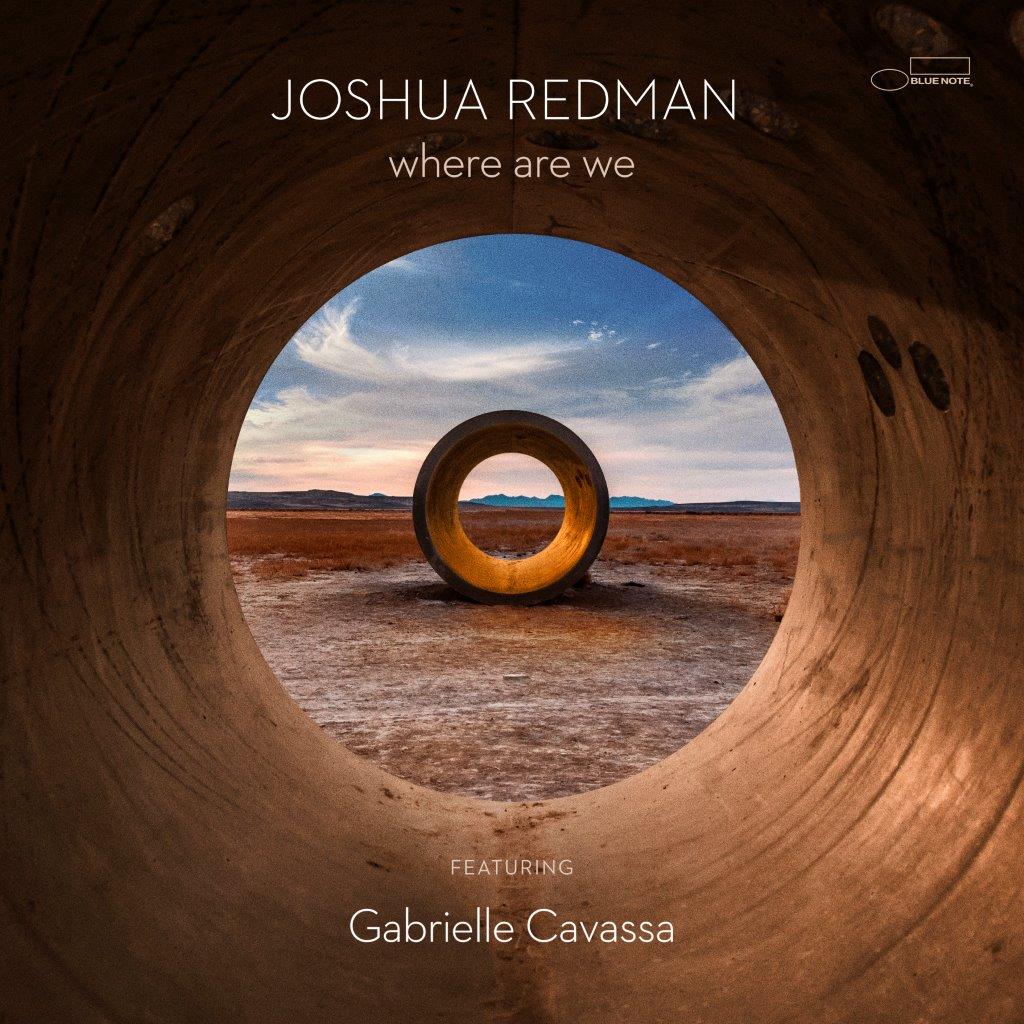 CD cover: desert landscape viewed through a circular tunnel opening.